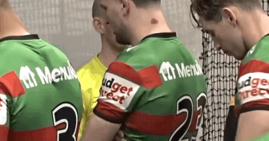 Jai Arrow leads the team out for his 100th appearance for South Sydney