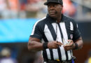 NFL umpire Larry Smith carted off early after slipping on moist subject in London