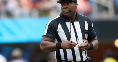 NFL umpire Larry Smith carted off early after slipping on moist subject in London